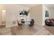 Bright dining room with a glass table, modern chairs, and stylish decor at 7222 Aspen Brook Ave, Frederick, CO 80530