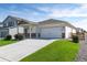 Charming home exterior featuring a well-maintained lawn and a convenient two-car garage at 7222 Aspen Brook Ave, Frederick, CO 80530