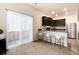 Contemporary kitchen with sleek cabinets, stainless steel appliances, and modern bar stools at 7222 Aspen Brook Ave, Frederick, CO 80530