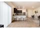 Stylish kitchen with breakfast bar, stainless steel appliances, and an adjacent dining area at 7222 Aspen Brook Ave, Frederick, CO 80530