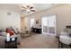 Bright living room with access to the patio, stylish furniture, and modern lighting at 7222 Aspen Brook Ave, Frederick, CO 80530
