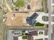 An aerial shot displays the house's layout and its position on a large lot still under development at 29585 E 165Th Ave, Brighton, CO 80603