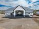 Aerial view showcasing the home's modern design with its covered patio and extensive gravel landscaping at 29585 E 165Th Ave, Brighton, CO 80603