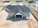 Overhead view highlighting the dark roof, light exterior, and covered patio of the new construction home at 29585 E 165Th Ave, Brighton, CO 80603