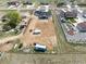 Wide aerial perspective shows the expansive, undeveloped yard surrounding the house at 29585 E 165Th Ave, Brighton, CO 80603