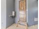 Unique bathroom showcasing a wooden door and a step stool, paired with an industrial vacuum system at 29585 E 165Th Ave, Brighton, CO 80603
