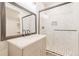 Updated bathroom featuring a glass enclosed shower, marble tile, and modern vanity at 29585 E 165Th Ave, Brighton, CO 80603