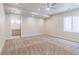 Spacious bedroom features plush carpeting, recessed lighting, and a modern ceiling fan at 29585 E 165Th Ave, Brighton, CO 80603