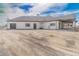 Spacious single-story home with a three-car garage, ample parking, and white exterior at 29585 E 165Th Ave, Brighton, CO 80603