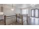 Elegant foyer with hardwood floors, chandelier lighting, and a staircase at 29585 E 165Th Ave, Brighton, CO 80603