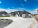 Attractive home featuring stone accents, meticulous landscaping, and circular driveway at 29585 E 165Th Ave, Brighton, CO 80603