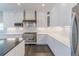Bright kitchen with white cabinets, stainless steel appliances, marble countertops and a center island at 29585 E 165Th Ave, Brighton, CO 80603