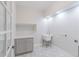 Charming laundry room with tile floor, gray cabinetry, and bright natural light at 29585 E 165Th Ave, Brighton, CO 80603