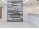 Stylish basement living area featuring an electric fireplace and wet bar at 29585 E 165Th Ave, Brighton, CO 80603