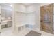 Bright mudroom featuring a white built-in storage bench with coat hooks and a rustic wood door at 29585 E 165Th Ave, Brighton, CO 80603