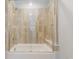 Elegant tile shower featuring a built-in bench, glass door and decorative pattern at 29585 E 165Th Ave, Brighton, CO 80603