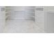 Large walk-in closet with custom shelving and marble floor at 29585 E 165Th Ave, Brighton, CO 80603