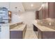 Modern wet bar area with granite countertops and stylish pendant lighting at 29585 E 165Th Ave, Brighton, CO 80603