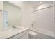 Bright bathroom featuring a vanity with a quartz countertop and a shower-over-tub with white subway tiles at 700 N Bently St, Watkins, CO 80137