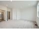 Spacious main bedroom with ensuite bathroom and neutral carpeting at 700 N Bently St, Watkins, CO 80137