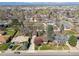 Neighborhood aerial view featuring well-maintained lawns and mature trees, with a mountain backdrop at 4625 S Huron St, Englewood, CO 80110