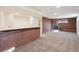 Finished basement featuring brick bar and fireplace, recessed lighting, and neutral carpet at 4625 S Huron St, Englewood, CO 80110