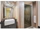 Stylish bathroom with a modern sink, vanity and glass-enclosed shower with stone flooring at 4625 S Huron St, Englewood, CO 80110