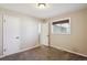 Neutral bedroom with closet, window and carpeted floor at 4625 S Huron St, Englewood, CO 80110