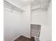 Walk-in closet featuring shelving, carpet and white walls at 4625 S Huron St, Englewood, CO 80110