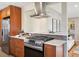 Well-equipped kitchen boasts stainless steel appliances and stylish tile backsplash at 4625 S Huron St, Englewood, CO 80110