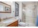 Bathroom with a granite-topped vanity and a glass-enclosed shower at 16522 Bluebonnet Dr, Parker, CO 80134