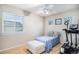 Bright bedroom with light-colored walls, a window, and an exercise machine at 16522 Bluebonnet Dr, Parker, CO 80134