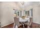 Bright dining room features hardwood floors, a chandelier, and sliding glass doors at 16522 Bluebonnet Dr, Parker, CO 80134