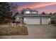 Charming two-story home with a three car garage and landscaped front yard at 16522 Bluebonnet Dr, Parker, CO 80134