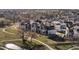 Beautiful aerial view of a neighborhood with walking paths, open spaces, and modern homes at 12242 W 56Th Pl, Arvada, CO 80002