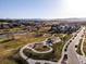 Aerial view of the neighborhood with a park, playground, and modern homes at 12242 W 56Th Pl, Arvada, CO 80002