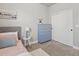 Serene bedroom with soft decor, a dresser, and a closet with sliding doors, creating a relaxing space at 12242 W 56Th Pl, Arvada, CO 80002