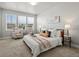 Bright bedroom with a bed placed between windows and a warm and inviting color palette at 12242 W 56Th Pl, Arvada, CO 80002