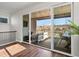 Covered patio with string lights, comfortable seating, and views of the surrounding landscape at 12242 W 56Th Pl, Arvada, CO 80002