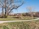 Picturesque walking path through a green space, perfect for leisurely strolls and enjoying nature at 12242 W 56Th Pl, Arvada, CO 80002