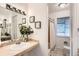 Bathroom features a shower and vanity with attractive decorations on display at 7957 Elm St, Louviers, CO 80131