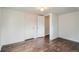 Bedroom features hardwood floors, neutral paint, and closet at 7957 Elm St, Louviers, CO 80131