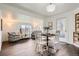 Bright dining room with hardwood floors, white trim, and a view of the outdoors at 7957 Elm St, Louviers, CO 80131