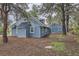 Charming blue house featuring a detached garage at 7957 Elm St, Louviers, CO 80131
