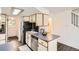 Functional kitchen space showcasing stainless steel appliances and an eat-in breakfast bar at 7957 Elm St, Louviers, CO 80131