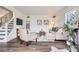 Bright living room with modern decor, comfortable seating, and dark wood floors at 7957 Elm St, Louviers, CO 80131