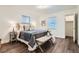 Cozy main bedroom with natural light, hardwood floors, and a walk-in closet at 7957 Elm St, Louviers, CO 80131