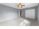 Bedroom featuring new carpet, fan, and large closet at 2285 Coronado Pkwy # D, Denver, CO 80229