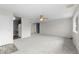Bright living room with ceiling fan, neutral carpet, and white walls at 2285 Coronado Pkwy # D, Denver, CO 80229
