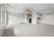 Neutral living room with access to kitchen, carpeted floor and sliding doors at 2285 Coronado Pkwy # D, Denver, CO 80229